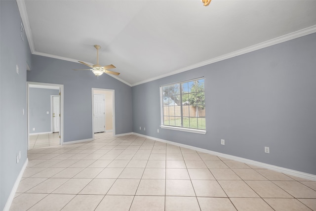 tiled spare room featuring vaulted ceiling, ceiling fan, and ornamental molding