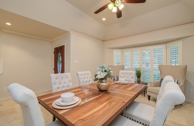 dining space with ceiling fan and crown molding