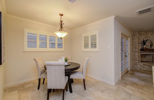 dining area featuring french doors and ornamental molding