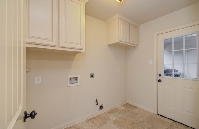 washroom with cabinets, hookup for a washing machine, and hookup for an electric dryer