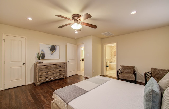 bedroom with dark wood-type flooring, ceiling fan, and ensuite bath