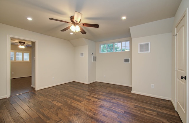 spare room featuring dark wood-type flooring and ceiling fan