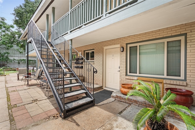 entrance to property featuring a patio