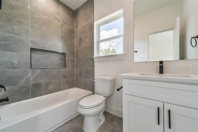 full bathroom with tiled shower / bath, toilet, and vanity