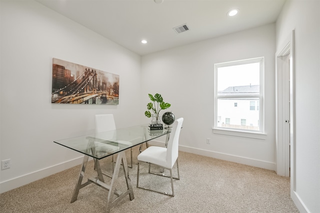 dining space with carpet flooring