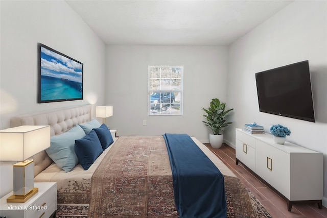 bedroom featuring dark hardwood / wood-style flooring