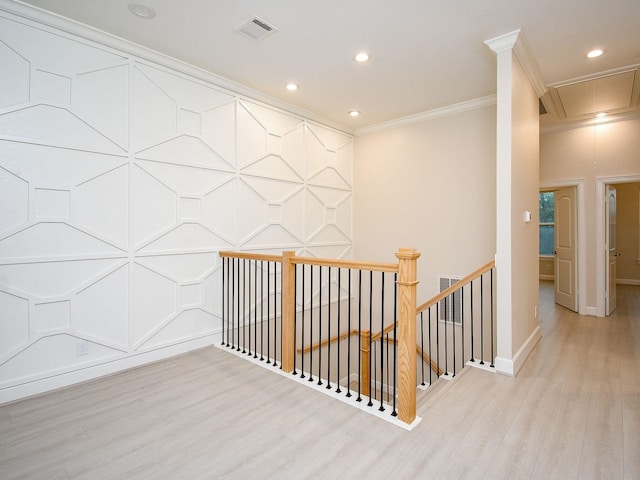 hall featuring ornamental molding and light wood-type flooring