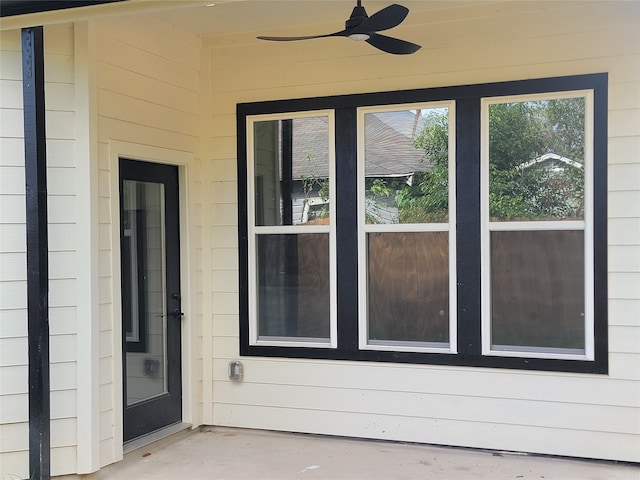 exterior space featuring ceiling fan