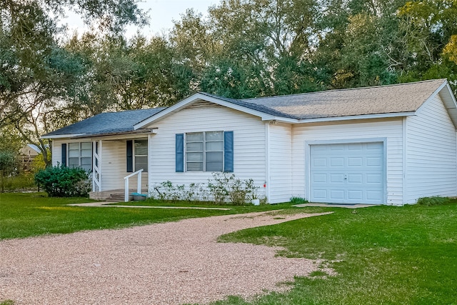 ranch-style house with a front lawn and a garage