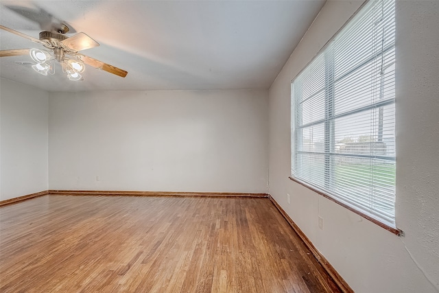 empty room featuring hardwood / wood-style floors and ceiling fan