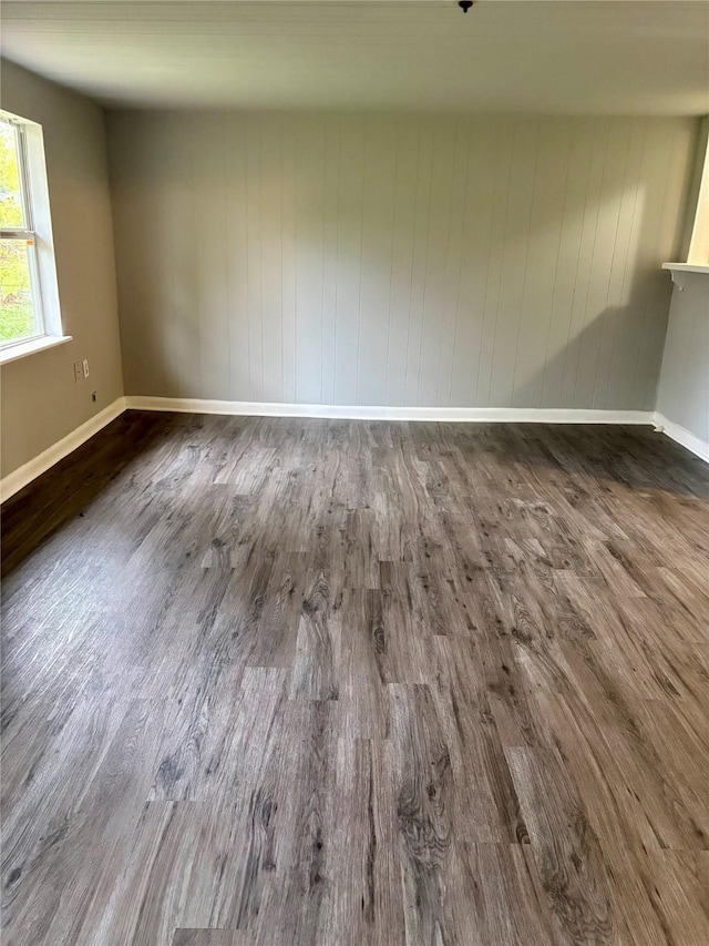 spare room with dark hardwood / wood-style floors