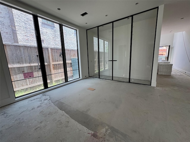 1606 Hazard St, Houston, TX 77019 - spare room featuring concrete floors
