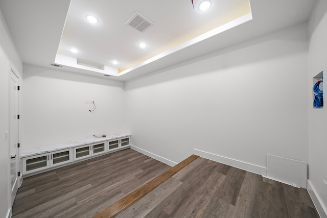 laundry area with baseboards, visible vents, dark wood finished floors, and recessed lighting