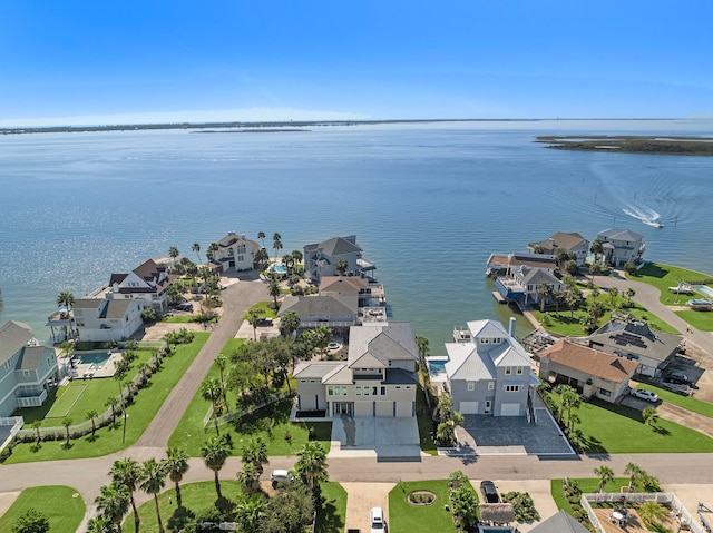 birds eye view of property featuring a water view and a residential view