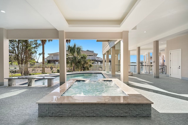 view of swimming pool featuring an in ground hot tub