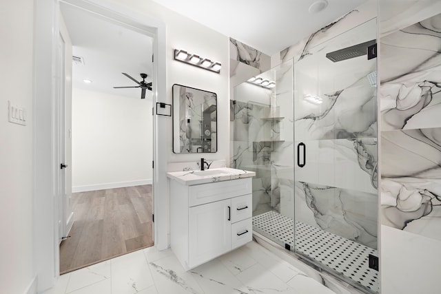 bathroom featuring a marble finish shower, visible vents, a ceiling fan, marble finish floor, and vanity