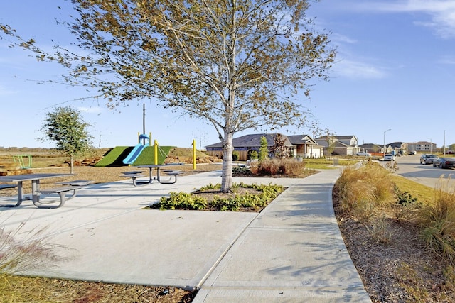 view of home's community featuring a playground