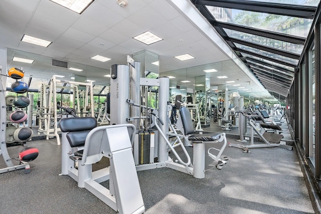 exercise room featuring a paneled ceiling