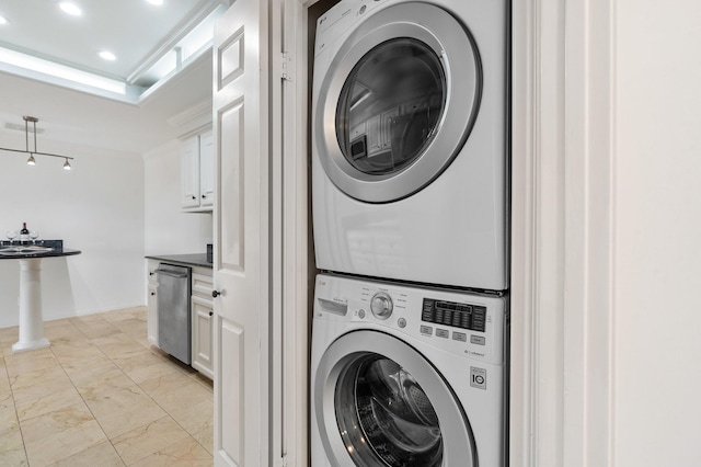 laundry room with stacked washer / dryer