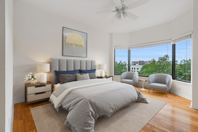 bedroom featuring hardwood / wood-style floors and ceiling fan