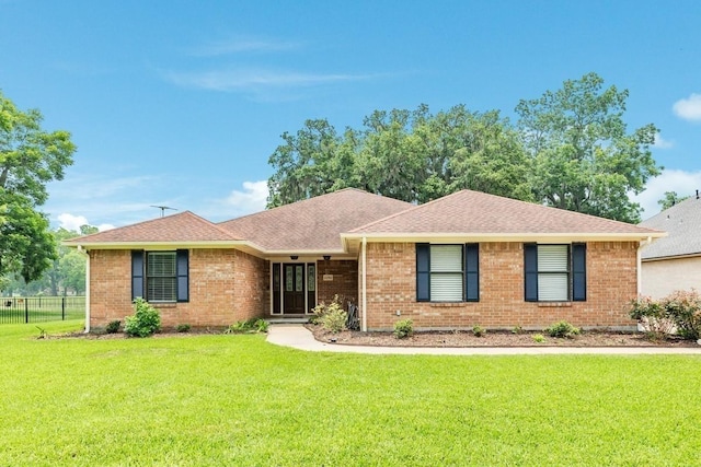 ranch-style home featuring a front yard