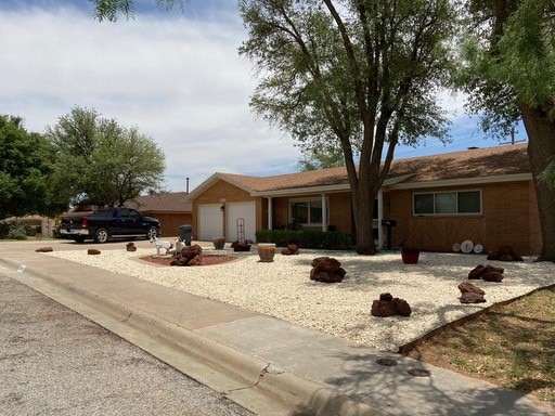 ranch-style home featuring a garage