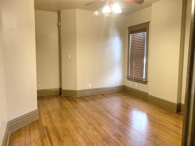 spare room featuring ceiling fan and light hardwood / wood-style floors