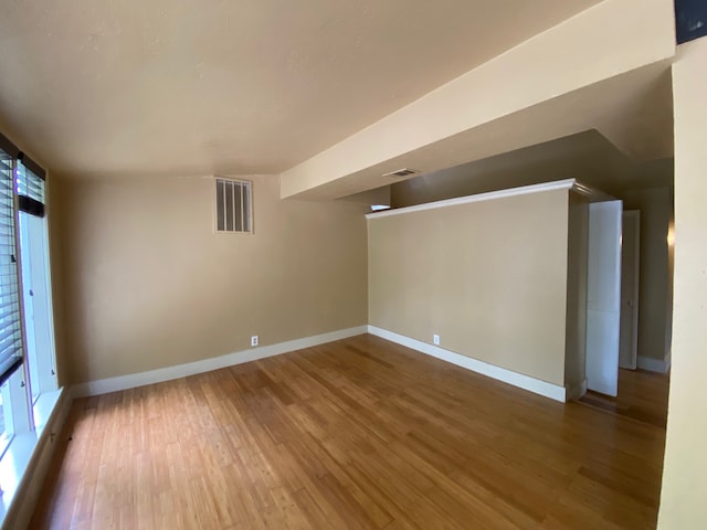 spare room with hardwood / wood-style floors