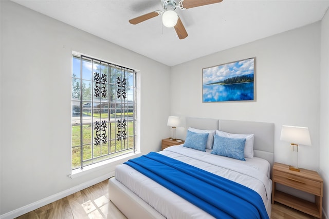 bedroom featuring hardwood / wood-style floors and ceiling fan