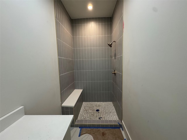 bathroom with tiled shower