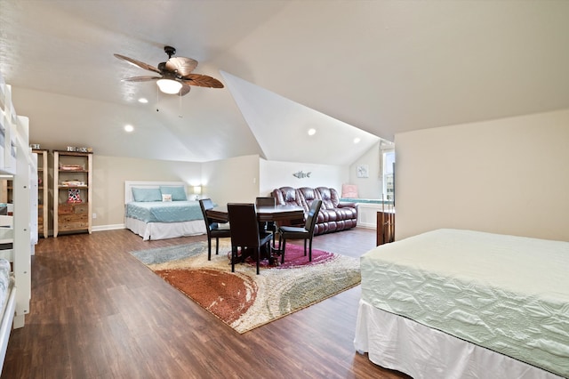 bedroom featuring dark wood-type flooring, lofted ceiling, and ceiling fan