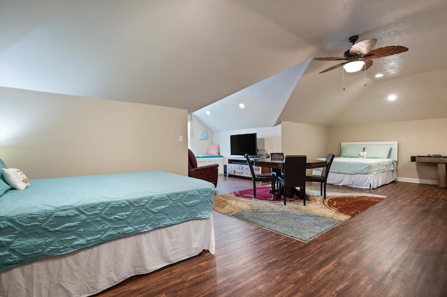 bedroom featuring dark hardwood / wood-style flooring, ceiling fan, and vaulted ceiling