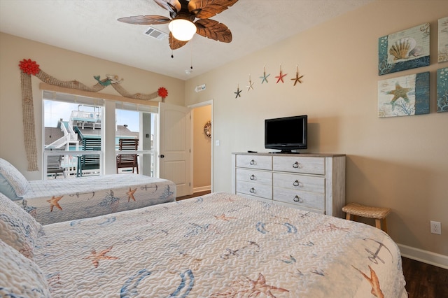 bedroom featuring ceiling fan and dark hardwood / wood-style floors