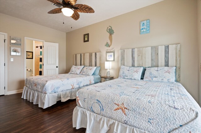 bedroom with dark hardwood / wood-style flooring, connected bathroom, and ceiling fan