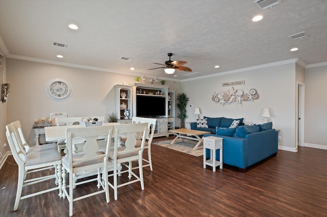 dining space featuring dark wood-type flooring, ceiling fan, a textured ceiling, and crown molding