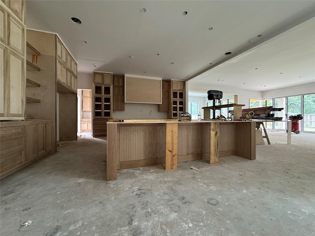 710 Glen Echo Ln, Hedwig Village, TX 77024 - kitchen featuring open shelves, a large island, and open floor plan