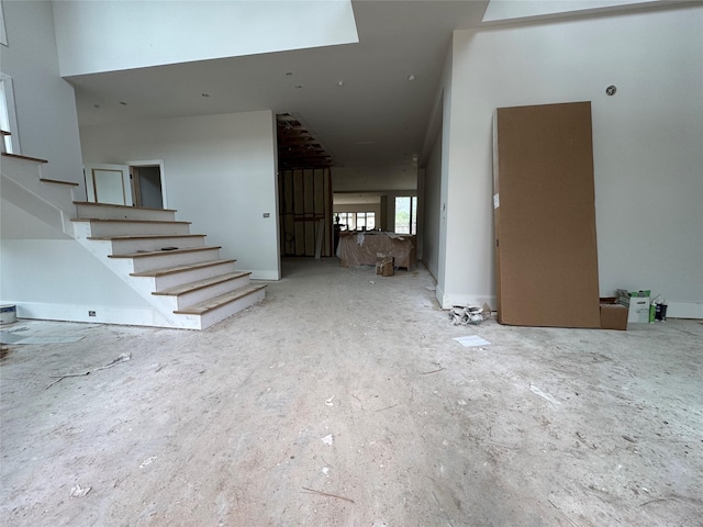 710 Glen Echo Ln, Hedwig Village, TX 77024 - unfurnished living room with stairs
