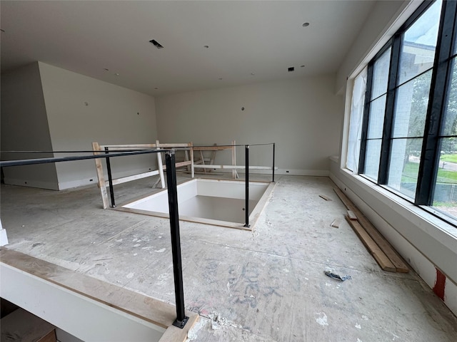 710 Glen Echo Ln, Hedwig Village, TX 77024 - empty room featuring healthy amount of natural light