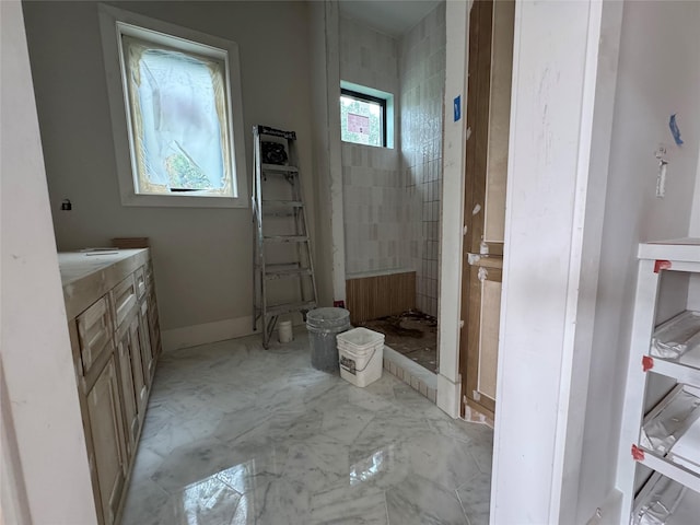 710 Glen Echo Ln, Hedwig Village, TX 77024 - full bath featuring vanity and marble look tile flooring