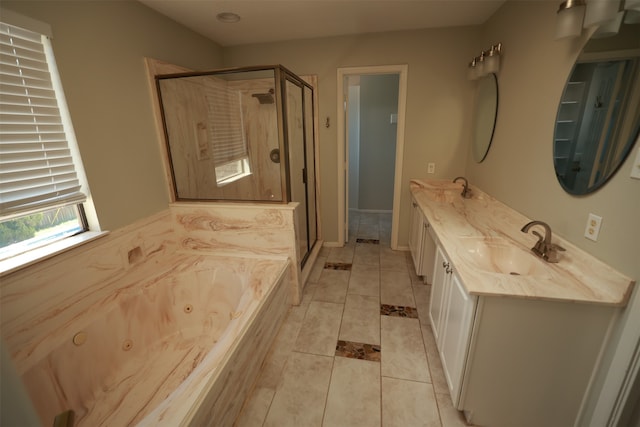 bathroom with tile patterned flooring, vanity, and independent shower and bath