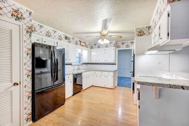 kitchen featuring white cabinets, light hardwood / wood-style floors, ceiling fan, and black appliances