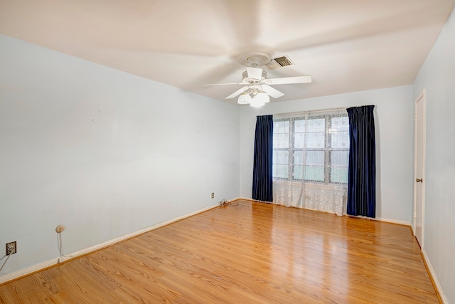 unfurnished room featuring light hardwood / wood-style floors and ceiling fan