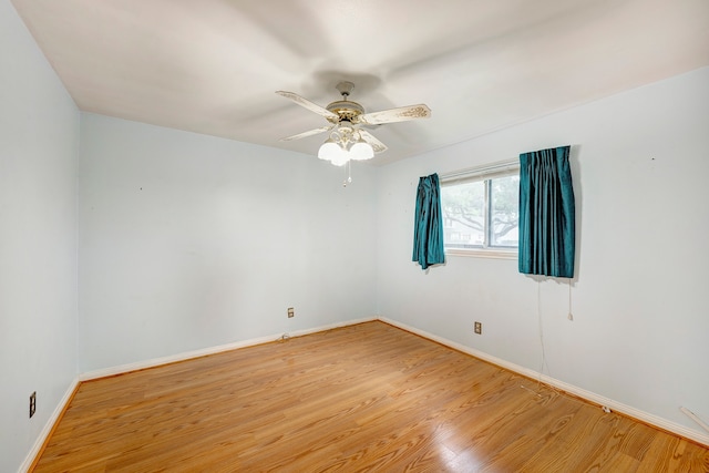 empty room with light wood-type flooring and ceiling fan