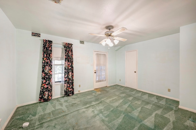 carpeted empty room with ceiling fan