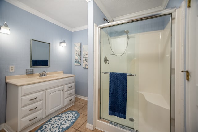 bathroom with vanity, tile patterned floors, ornamental molding, and a shower with shower door