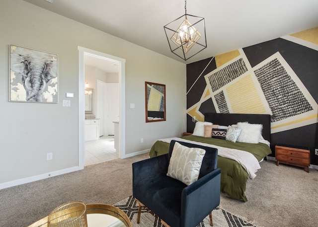 carpeted bedroom featuring a chandelier and ensuite bath