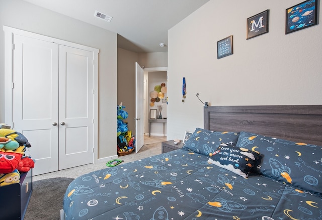 carpeted bedroom featuring a closet