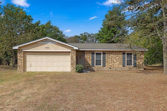 single story home featuring a garage and a front lawn