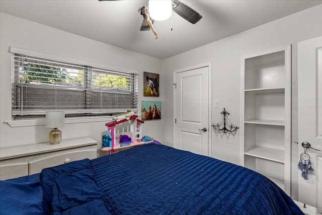 bedroom featuring multiple windows and ceiling fan