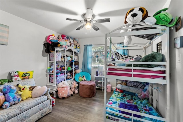 bedroom with wood-type flooring and ceiling fan